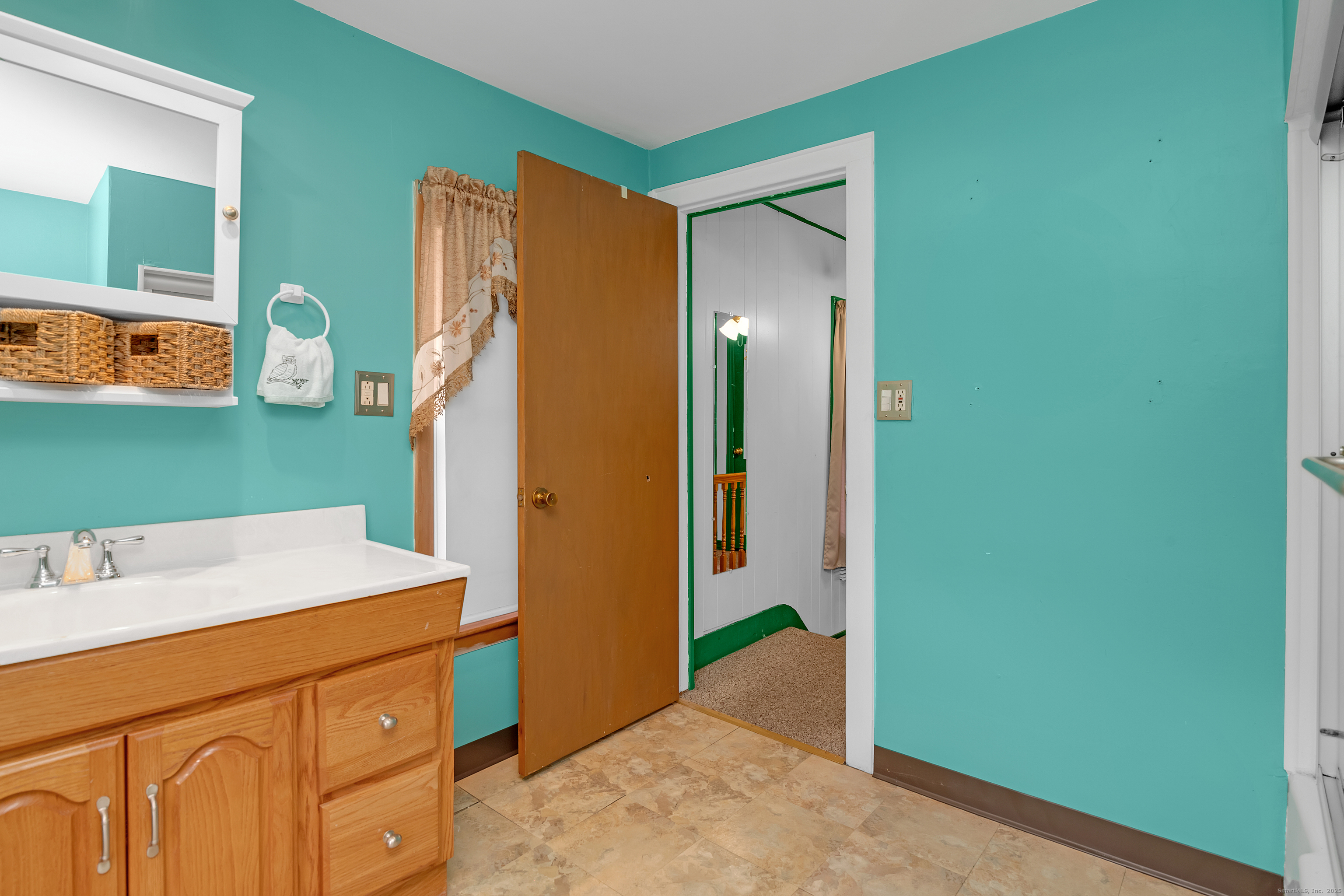 22 Lewis Street Naugatuck, CT 06770 - Photo 23 of 31 a room with a refrigerator and a dresser