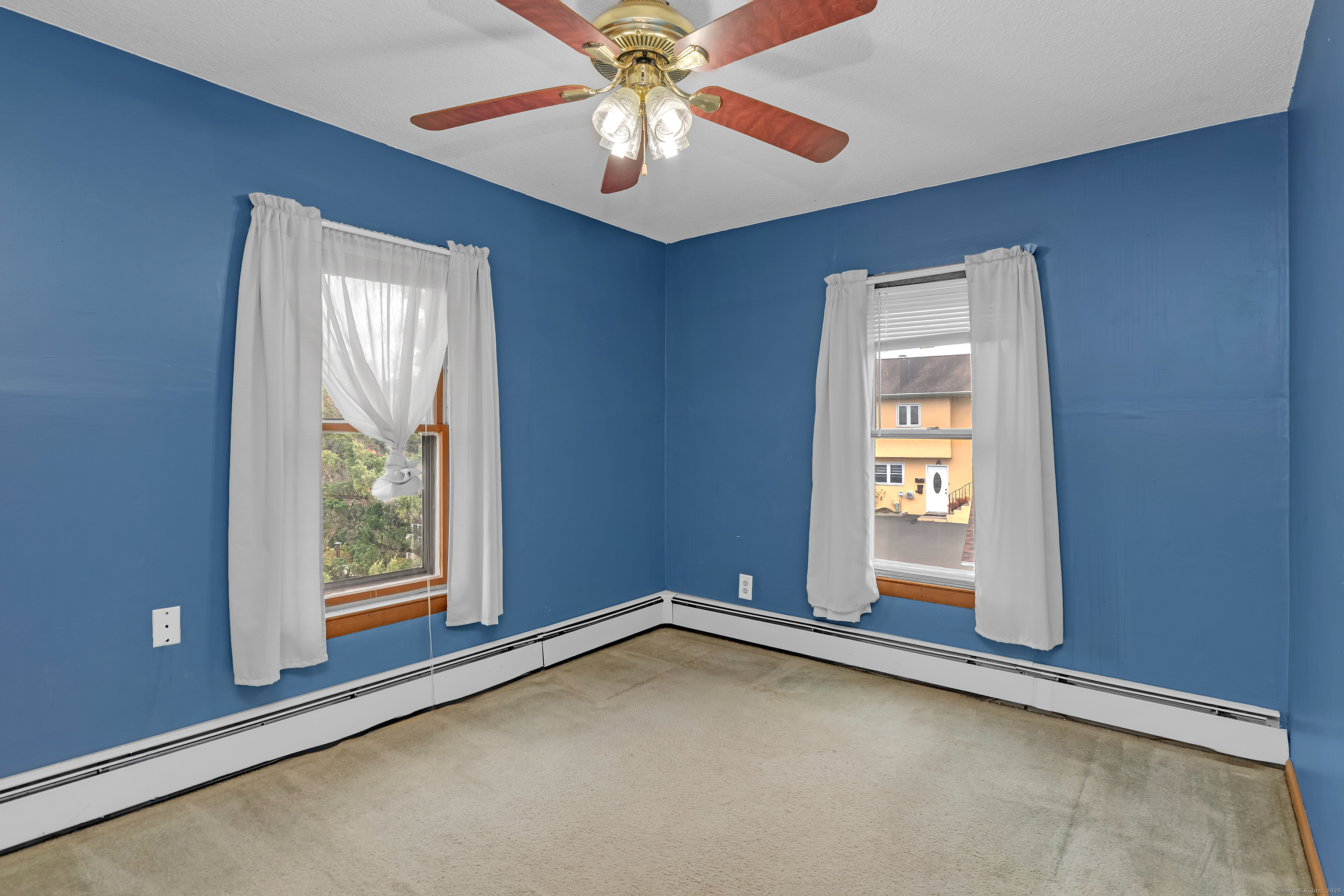 22 Lewis Street Naugatuck, CT 06770 - Photo 24 of 31 an empty room with windows and fan