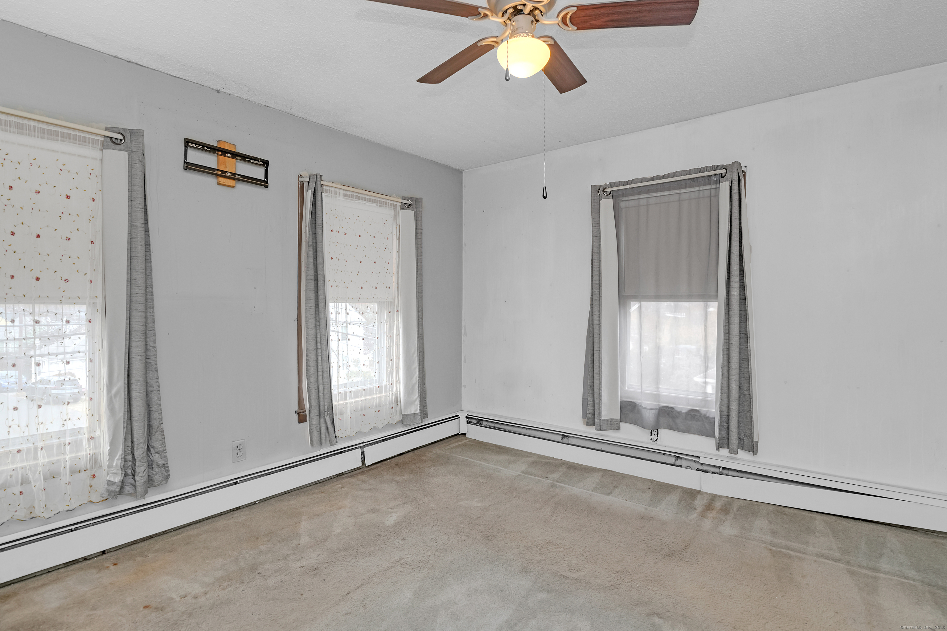 22 Lewis Street Naugatuck, CT 06770 - Photo 26 of 31 a view of an empty room with a window