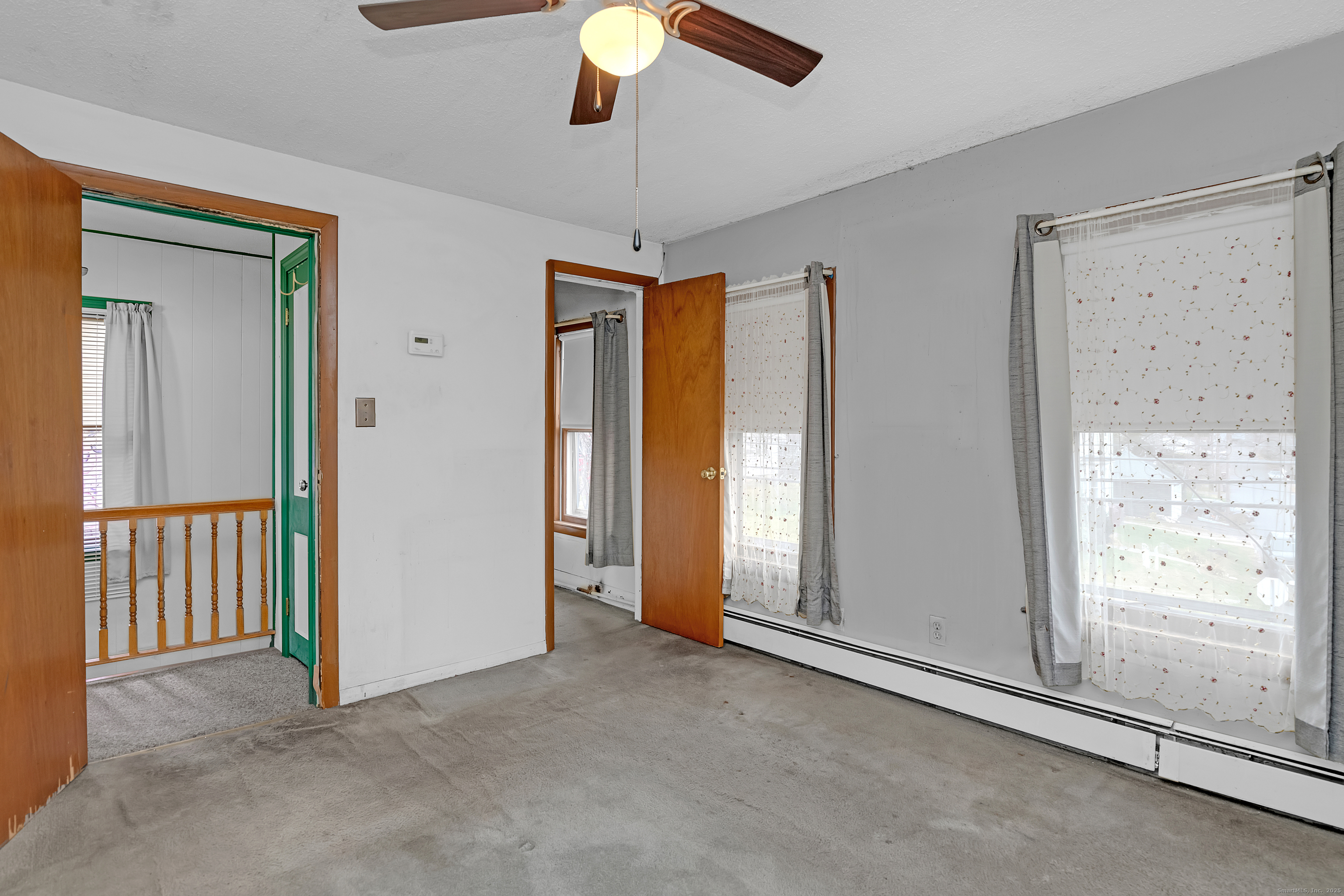 22 Lewis Street Naugatuck, CT 06770 - Photo 27 of 31 an empty room with windows and closet area