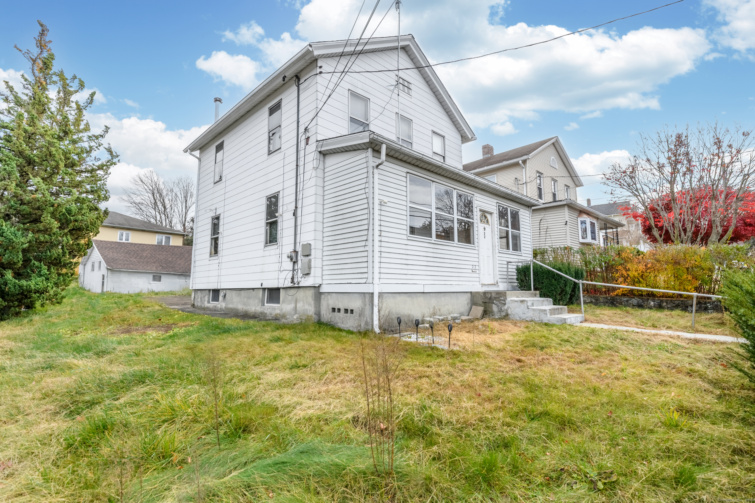22 Lewis Street Naugatuck, CT 06770 - Photo 5 of 31 a view of a house with a yard