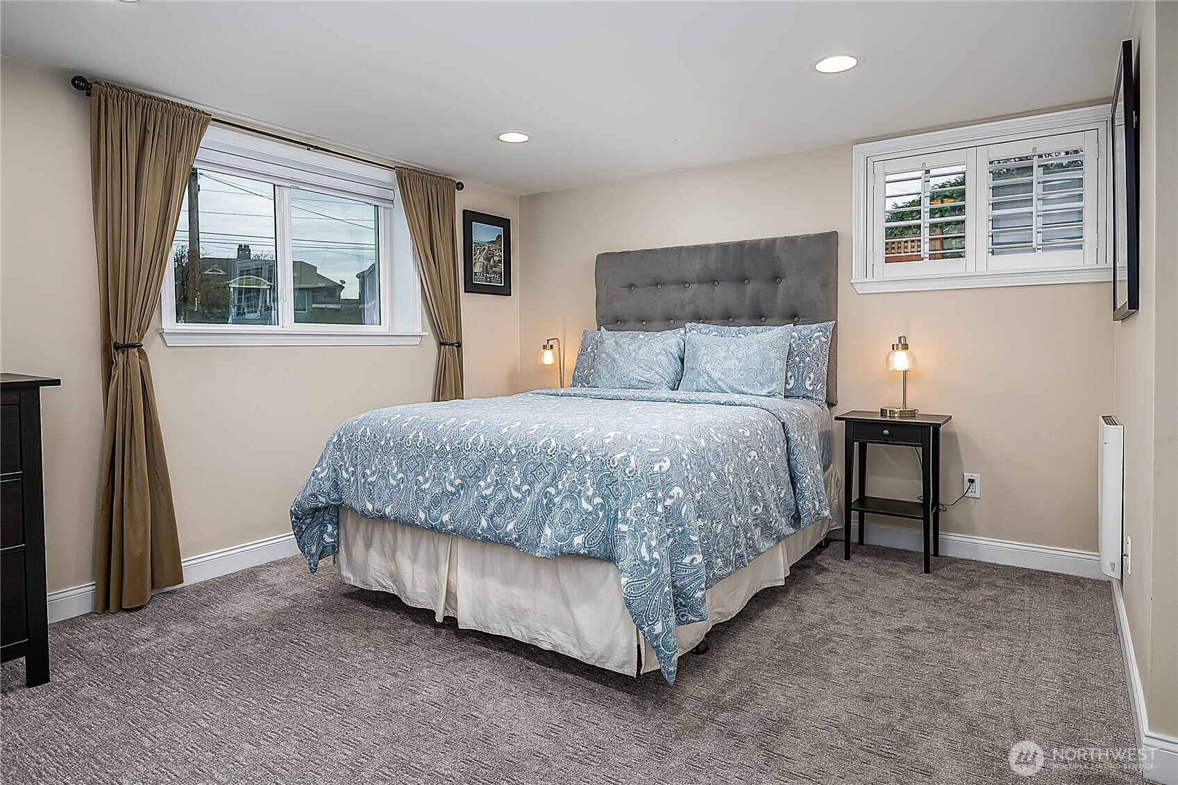 7638 Winona Avenue North, Unit B Seattle, WA 98103 - Photo 10 of 20 a bedroom with a bed lamp and a window