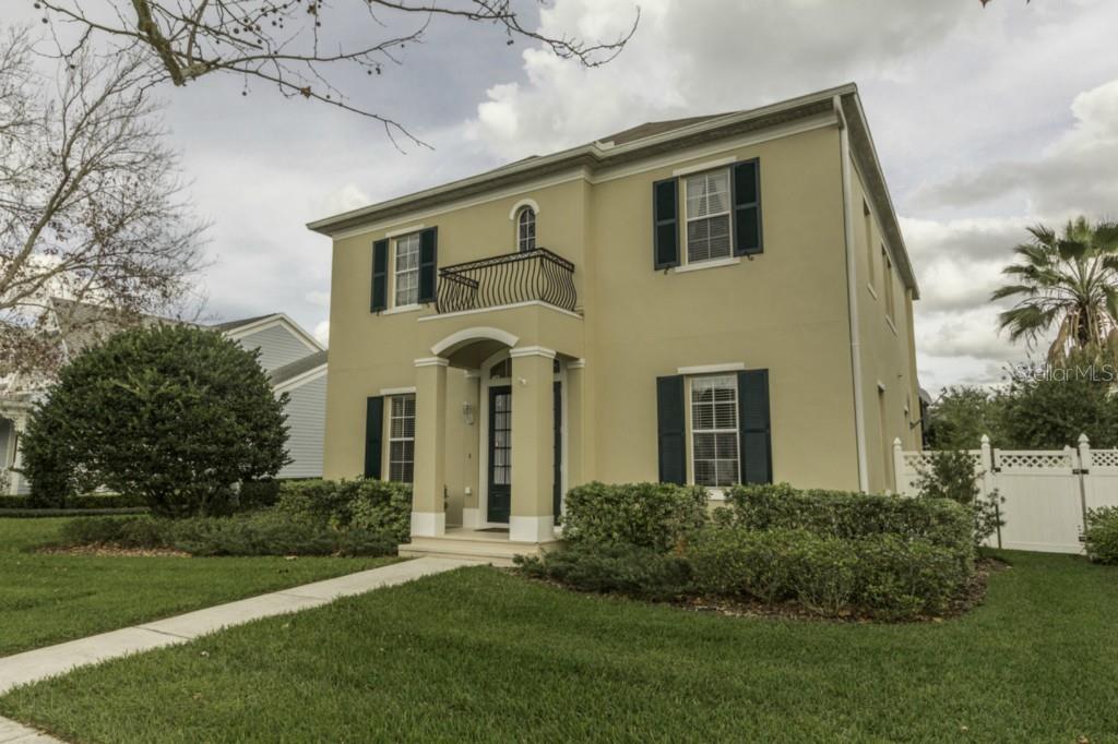 411 Sycamore Street Celebration, FL 34747 - Photo 1 of 1 a front view of a house with a yard