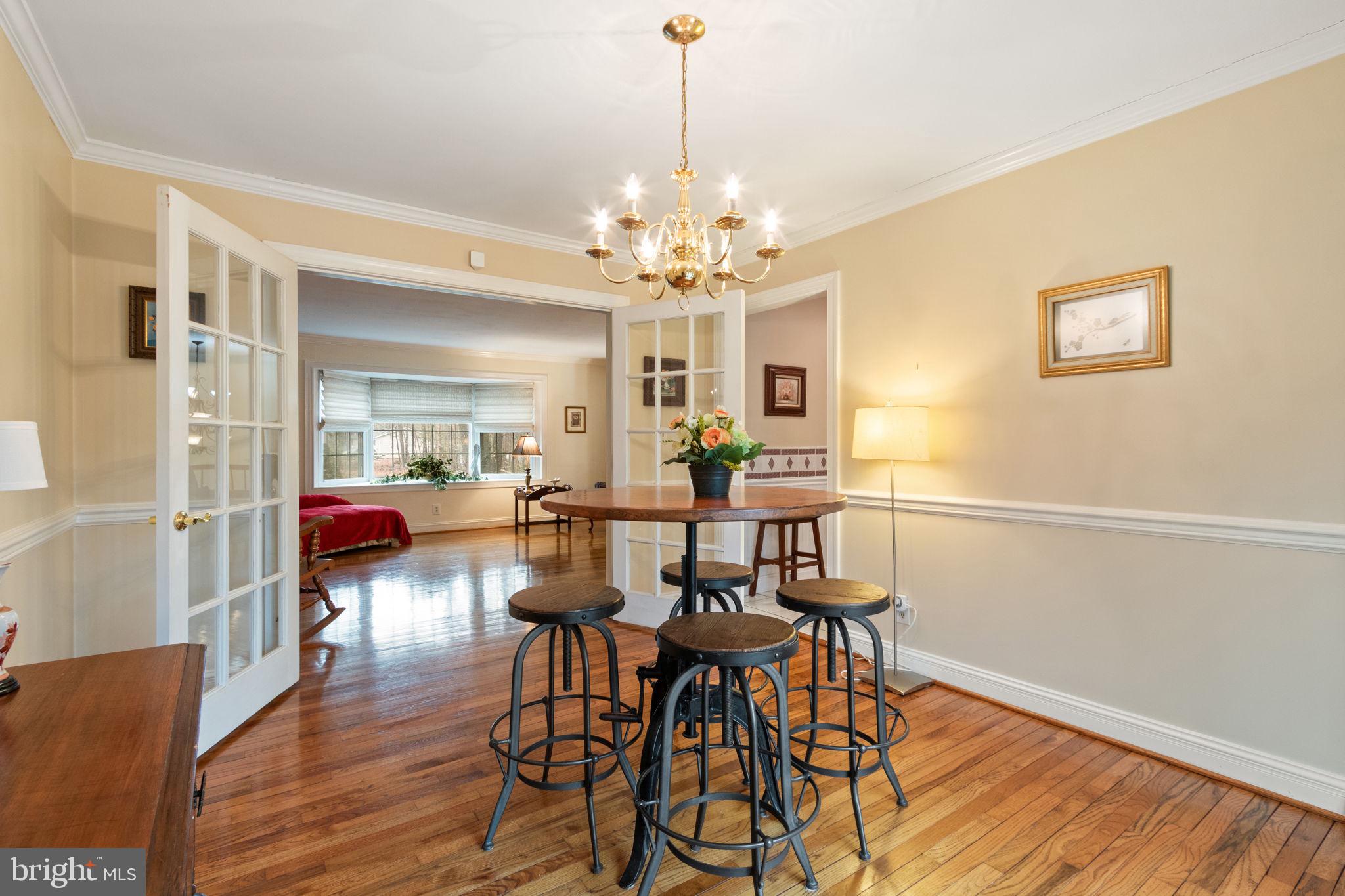 54 Richards Ferry Road Fredericksburg, VA 22406 - Photo 12 of 53 a view of a dining room with furniture and wooden floor