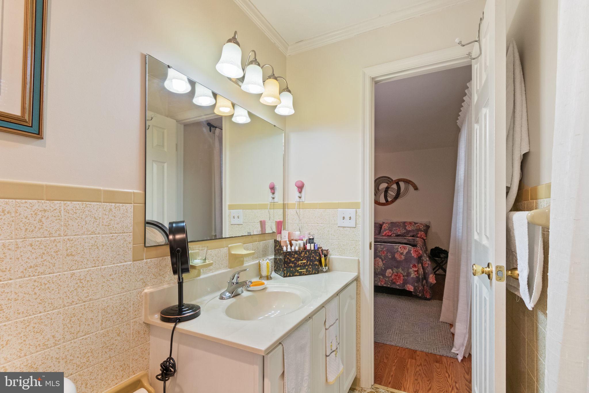 54 Richards Ferry Road Fredericksburg, VA 22406 - Photo 28 of 53 a bathroom with a sink a mirror and a light fixture