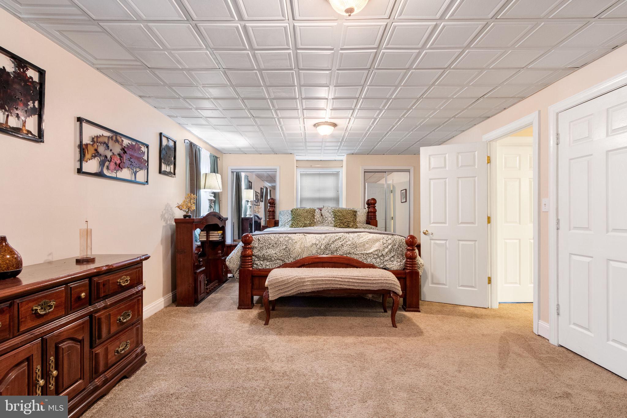 54 Richards Ferry Road Fredericksburg, VA 22406 - Photo 36 of 53 a bedroom with a bed and a chandelier