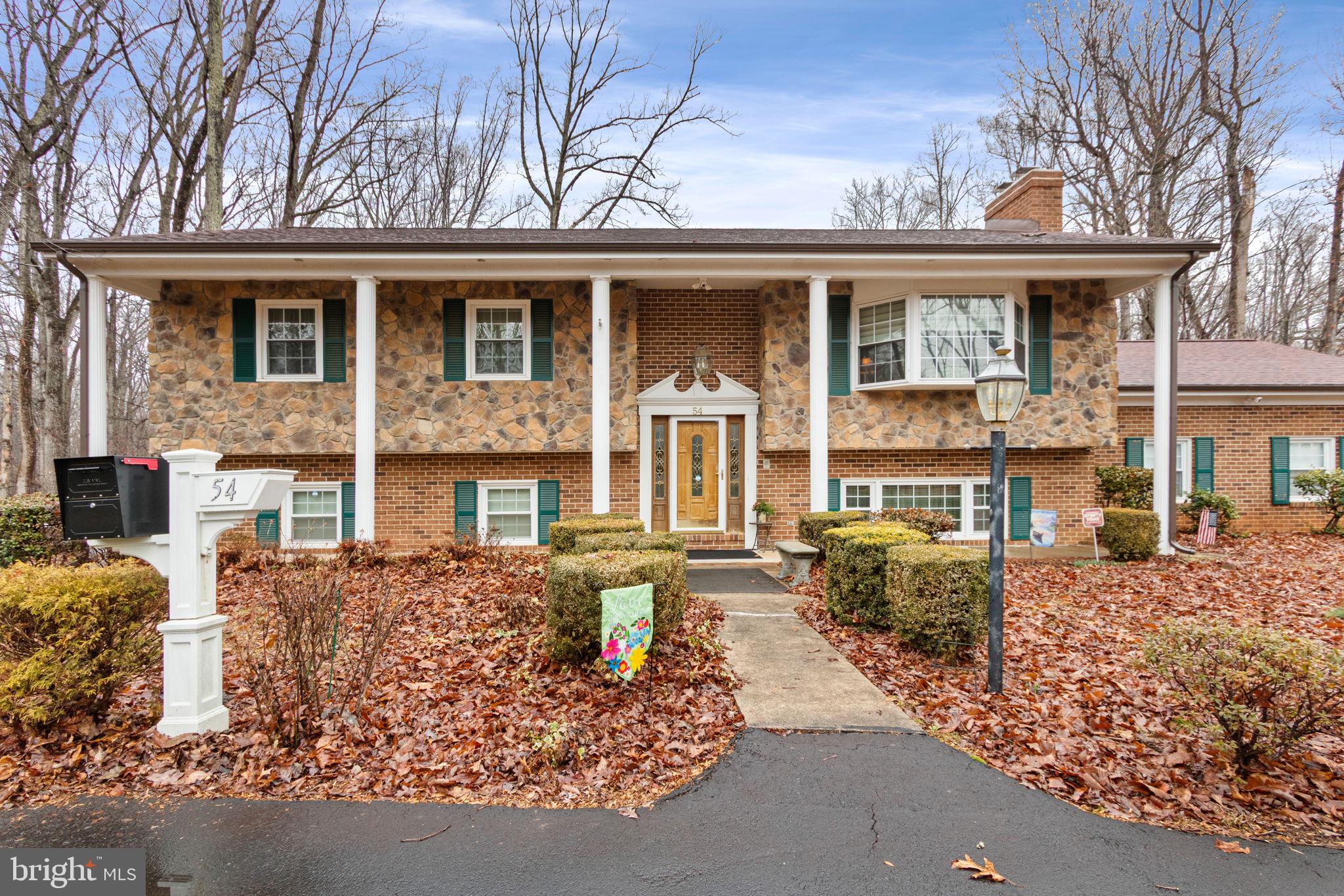 54 Richards Ferry Road Fredericksburg, VA 22406 - Photo 51 of 53 front view of a brick house with a large windows