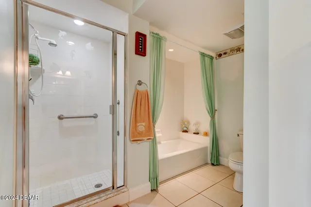 a bathroom with a double vanity sink toilet and shower