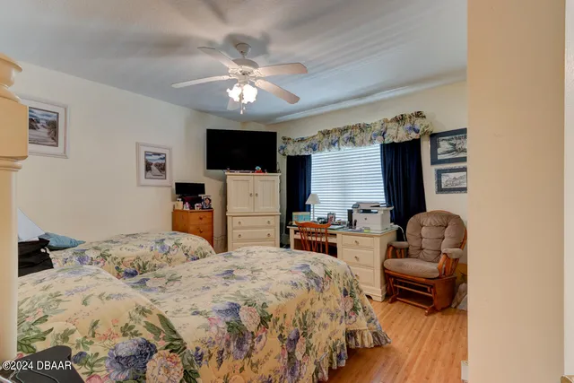 a spacious bathroom with a double vanity sink and a mirror