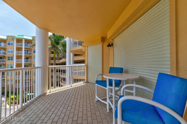 a view of a house with wooden deck