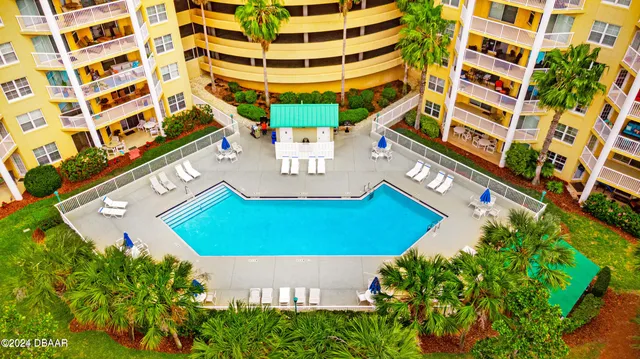 a view of balcony with two chairs and a table