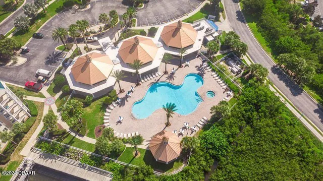 a living room with lots of furniture and kitchen view