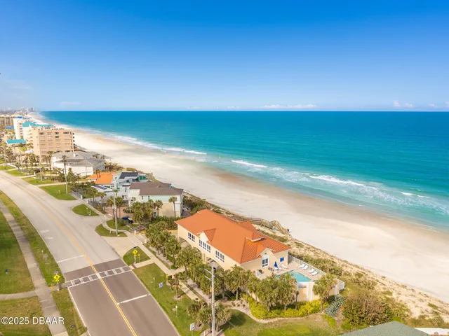 a room with furniture pool table and windows