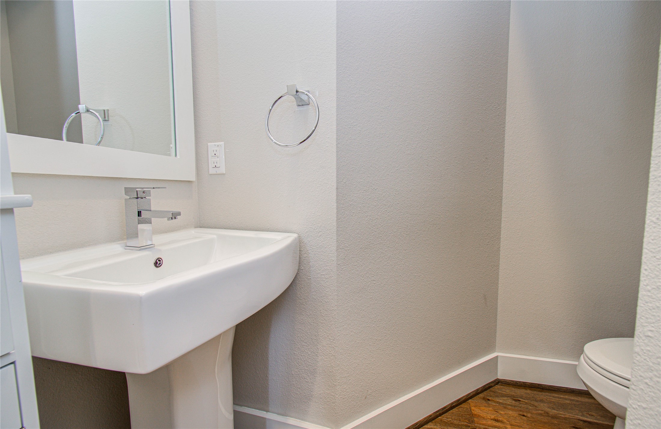 3516 Bastrop Street Houston, TX 77004 - Photo 12 of 25 a bathroom with a sink a toilet and a mirror