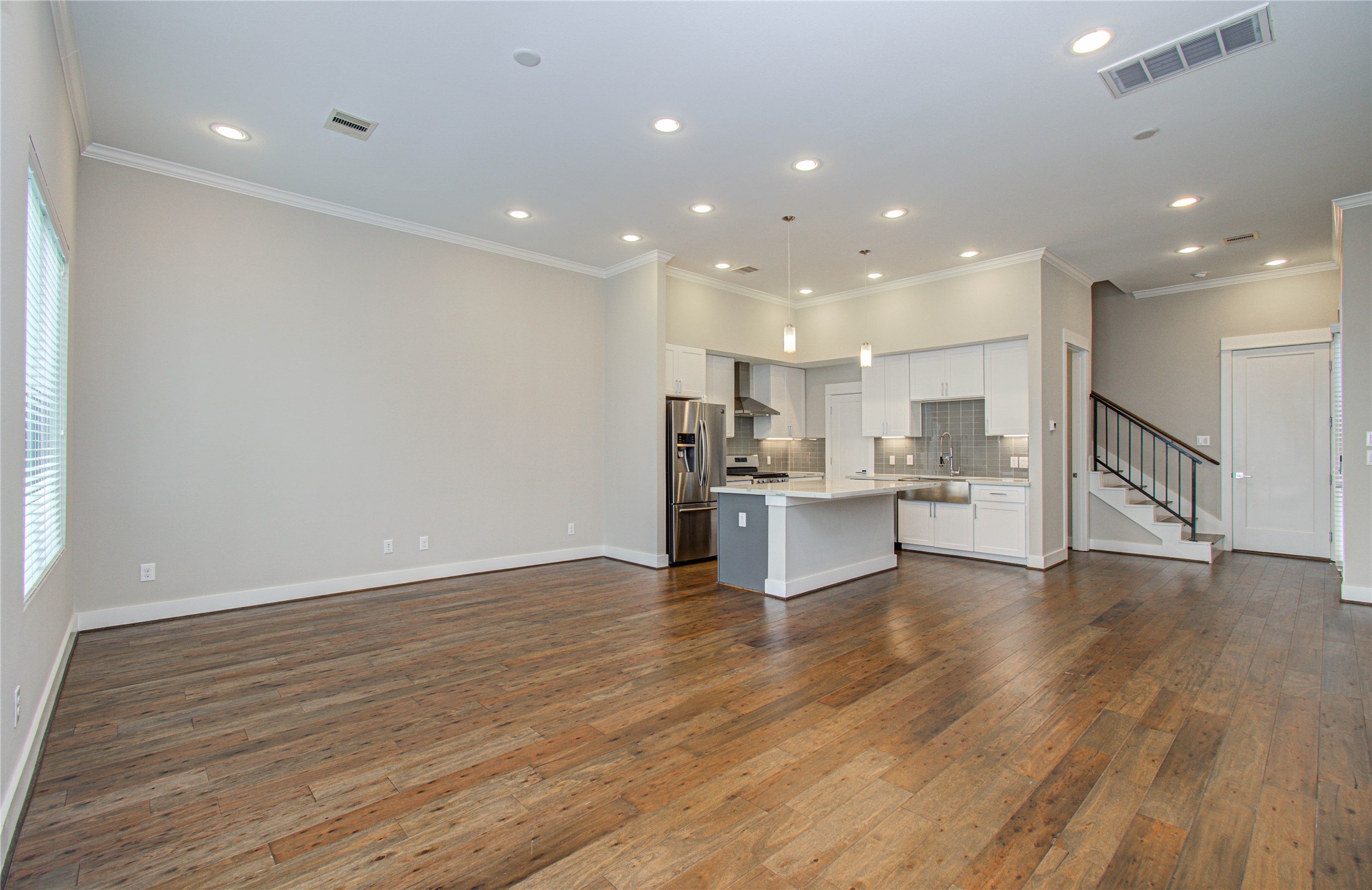 3516 Bastrop Street Houston, TX 77004 - Photo 9 of 25 a view of kitchen dining table chairs microwave and cabinets