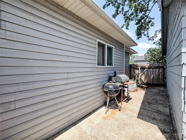 a view of a house with a yard patio and swimming pool
