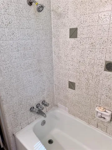 a bathroom with a sink and a shower