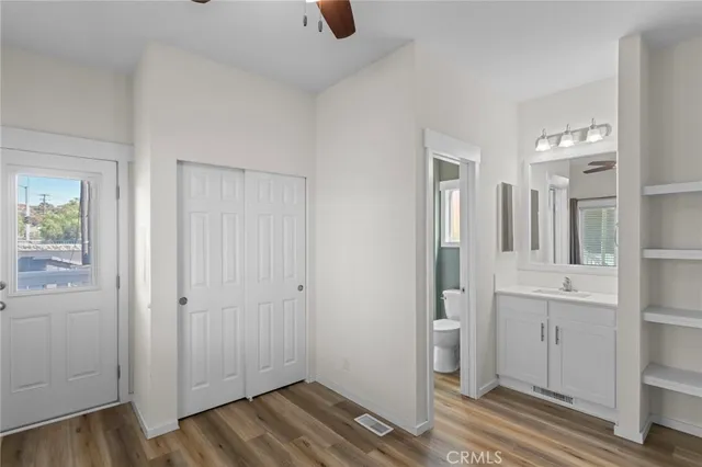 a view of a bathroom with a sink and mirror