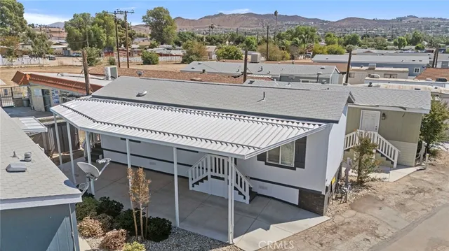 a view of a terrace with couches and wooden floor