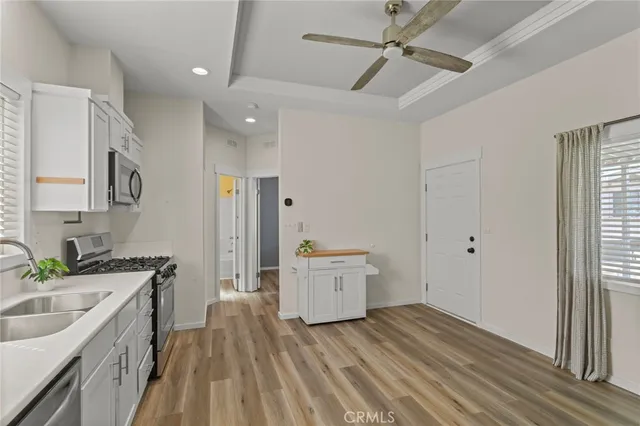 a open kitchen with a sink stove and refrigerator