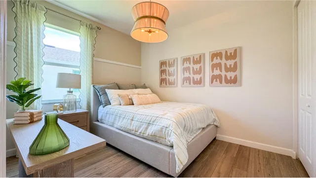 a bedroom with a bed and window