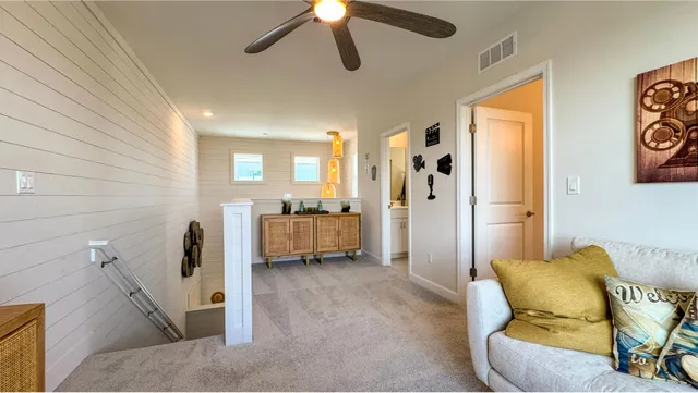 a living room with furniture and a rug