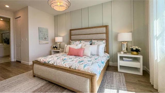 a bedroom with a bed and a lamp