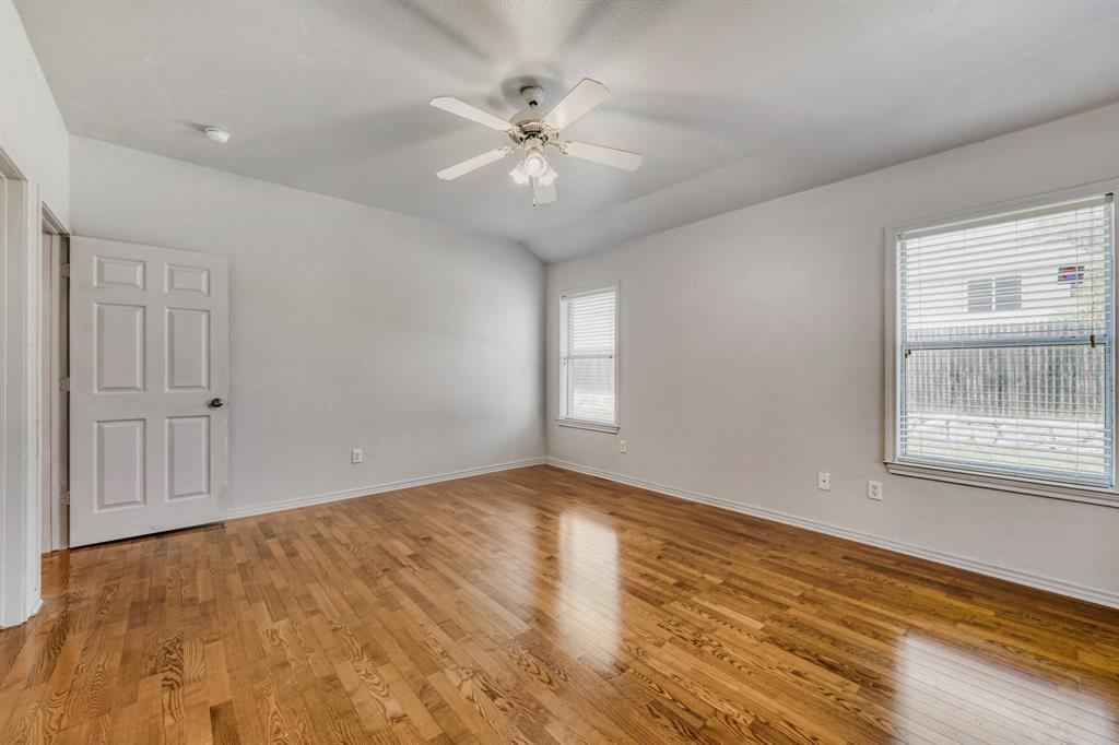 2617 Hereford Road Denton, TX 76210 - Photo 15 of 27 wooden floor in an empty room with a window