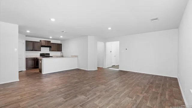 a view of kitchen with microwave and cabinets