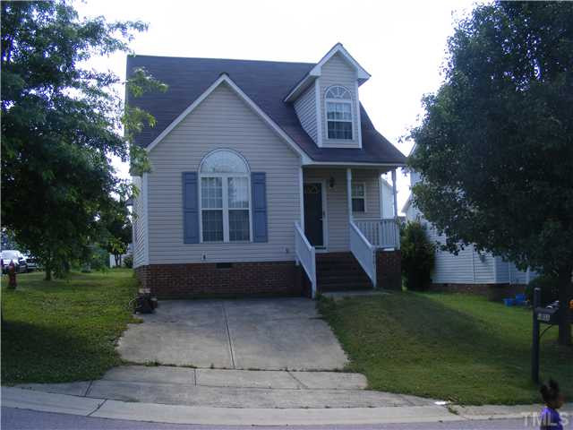 4901 Windproof Way Raleigh, NC 27616 - Photo 1 of 15 a front view of a house with a garden