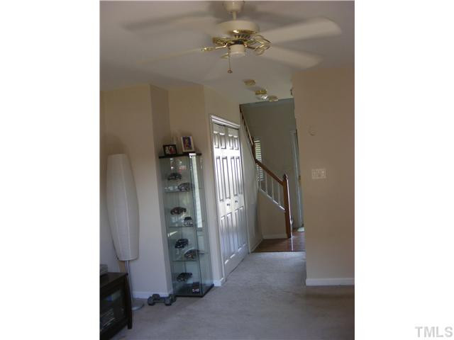 4901 Windproof Way Raleigh, NC 27616 - Photo 6 of 15 a view of a hallway with chandelier