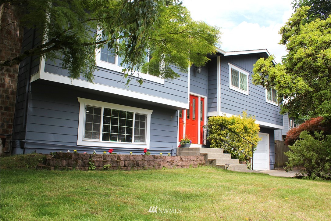 709 222nd Street Southwest Bothell, WA 98021 - Photo 2 of 38 a house that has a big yard and large trees