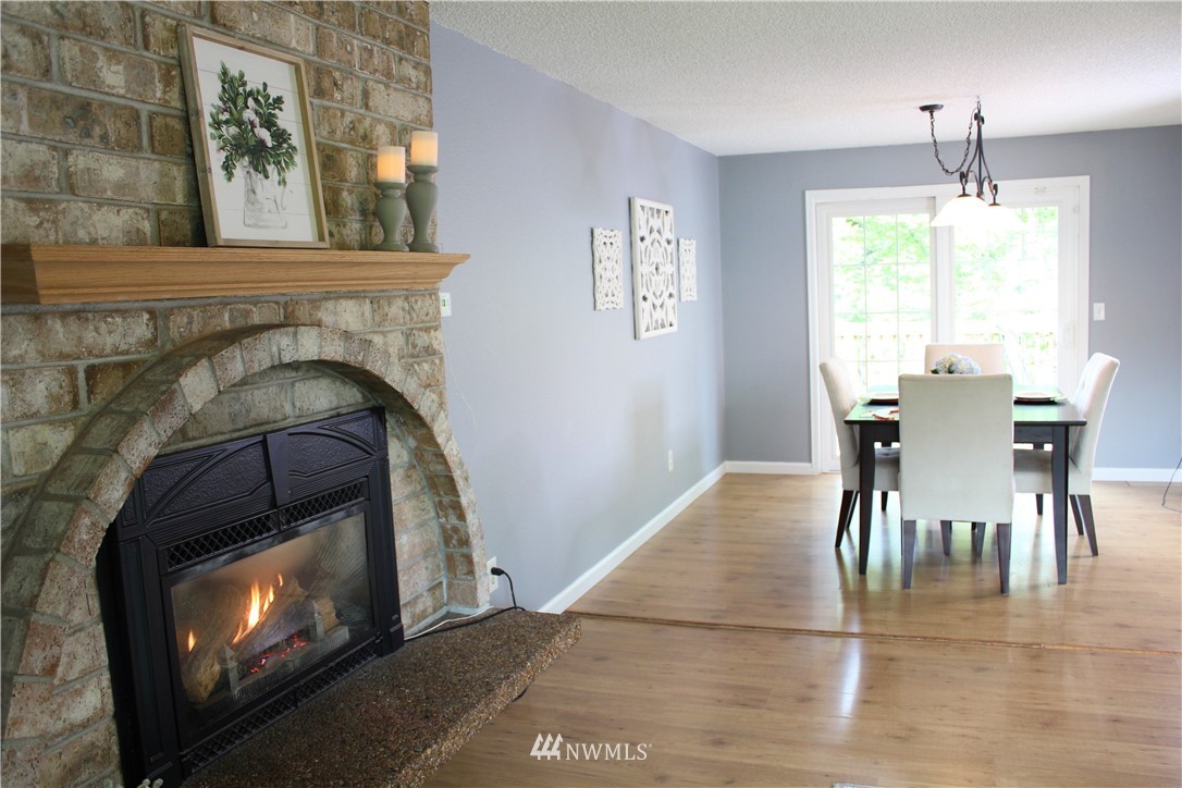 709 222nd Street Southwest Bothell, WA 98021 - Photo 11 of 38 a view of a dining room with furniture and chandelier