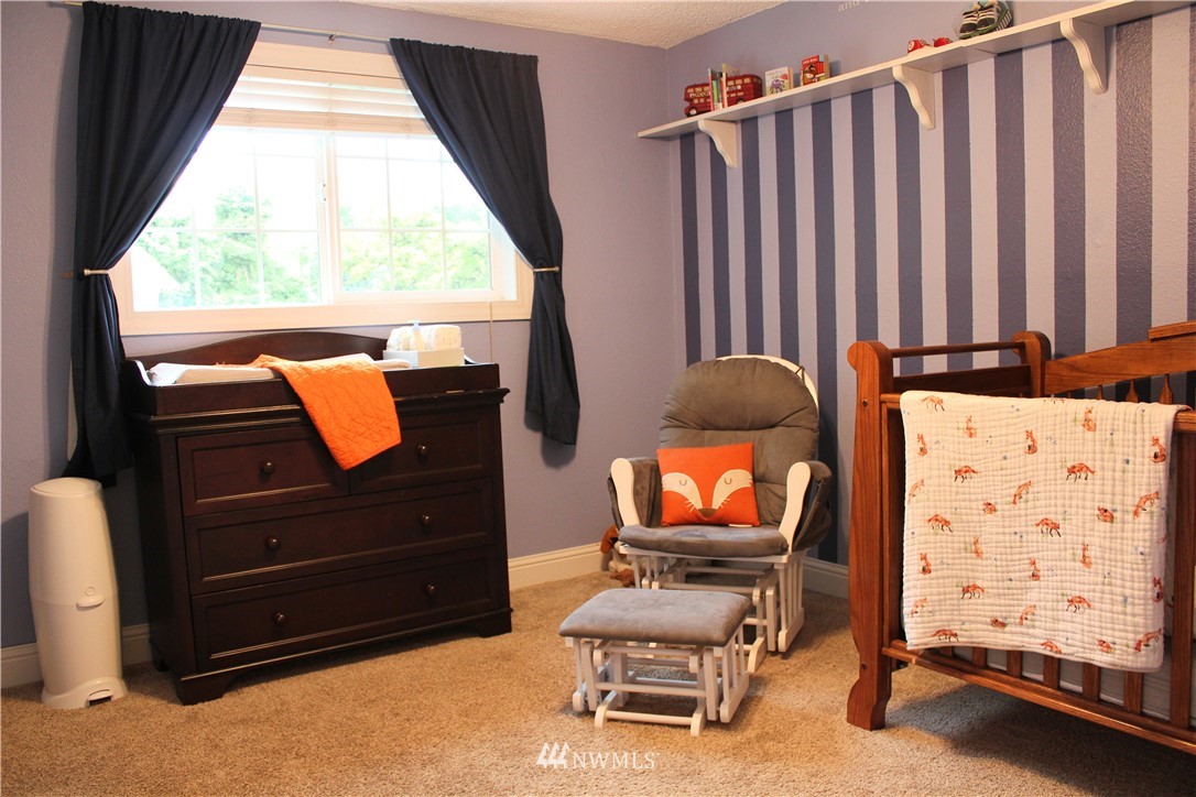 709 222nd Street Southwest Bothell, WA 98021 - Photo 15 of 38 a living room with furniture and a window