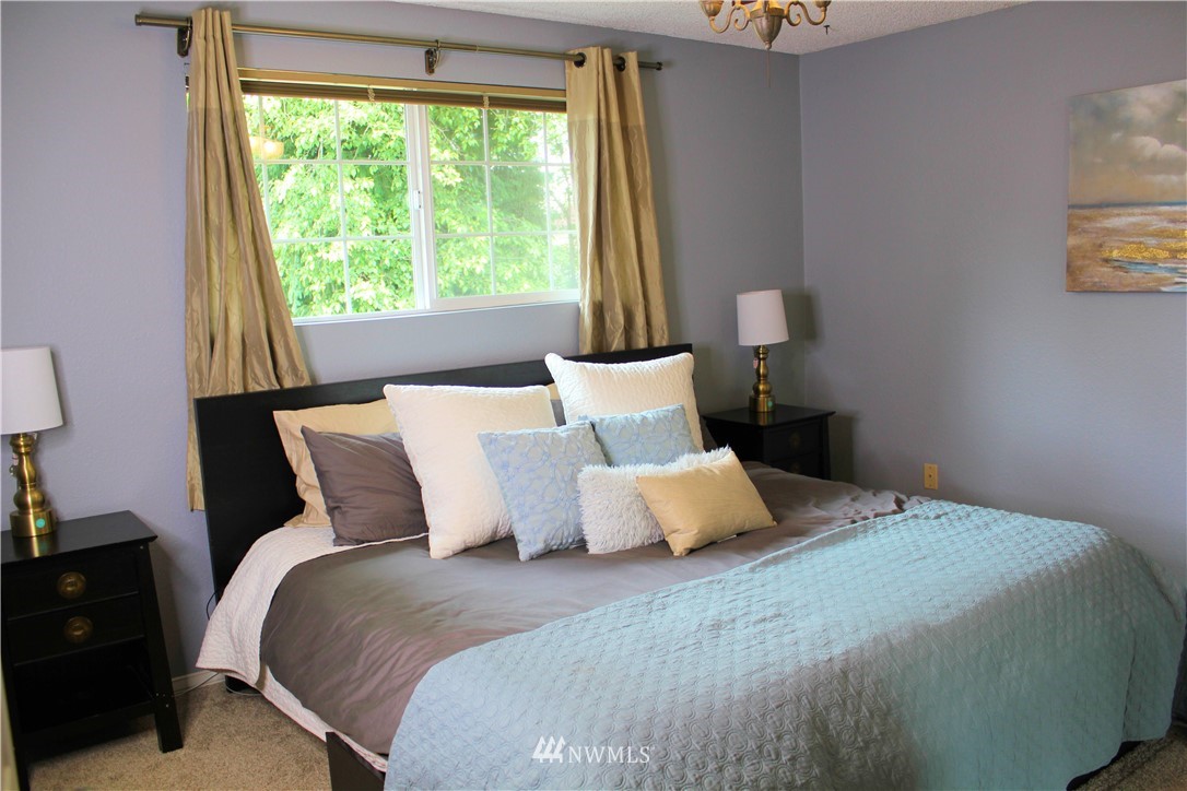 709 222nd Street Southwest Bothell, WA 98021 - Photo 18 of 38 a bedroom with a bed and window
