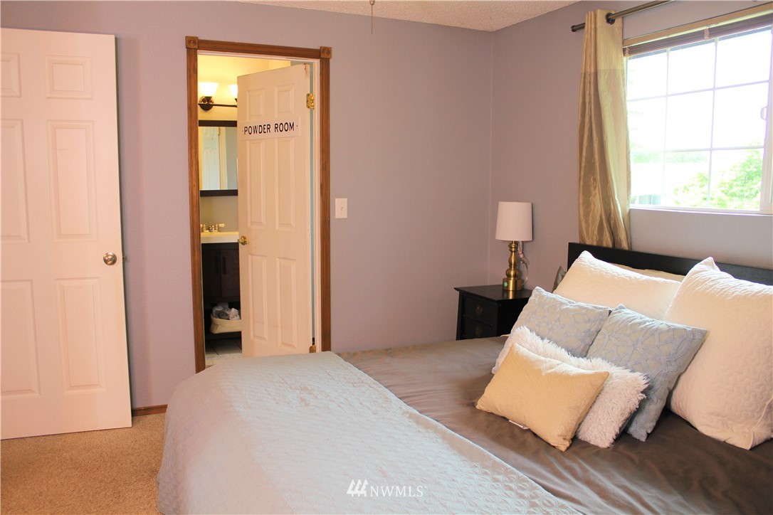 709 222nd Street Southwest Bothell, WA 98021 - Photo 19 of 38 a bedroom with a bed and a window