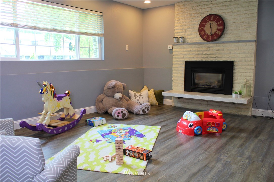 709 222nd Street Southwest Bothell, WA 98021 - Photo 21 of 38 a bedroom with a bed and a wooden floor