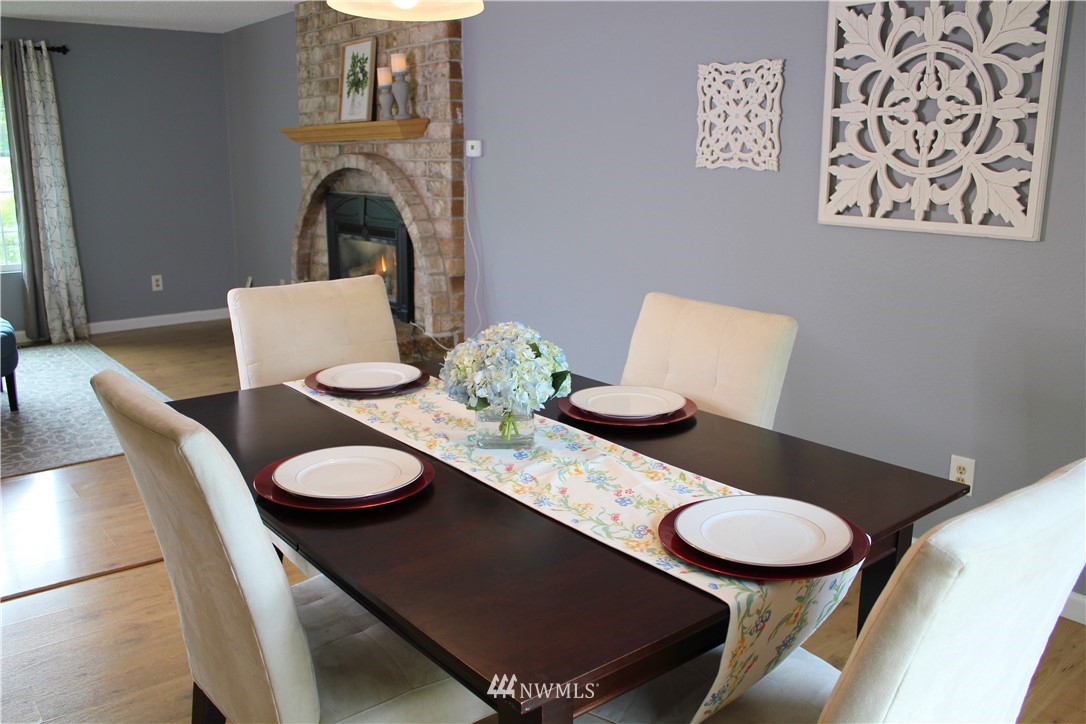 709 222nd Street Southwest Bothell, WA 98021 - Photo 10 of 38 a dining room with furniture and wooden floor