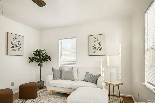 a living room with furniture and a window