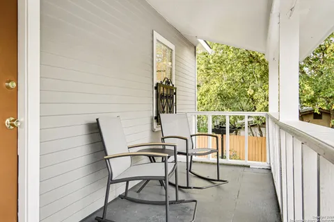 a view of a chairs and table in patio