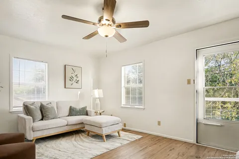a living room with furniture and a window