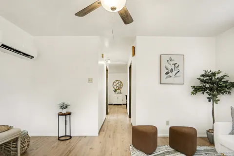 a view of a livingroom with furniture and wooden floor