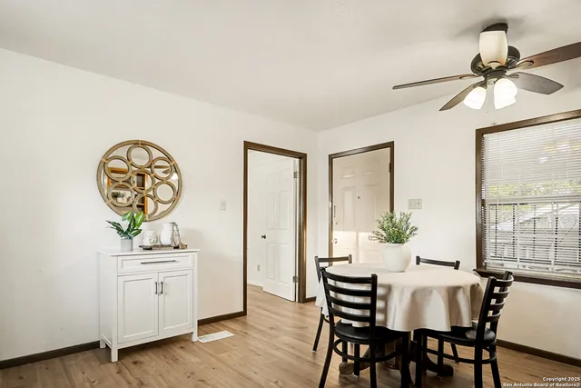 a view of a dining room with furniture window and wooden floor