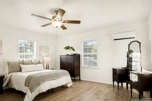 a bedroom with a bed and a table