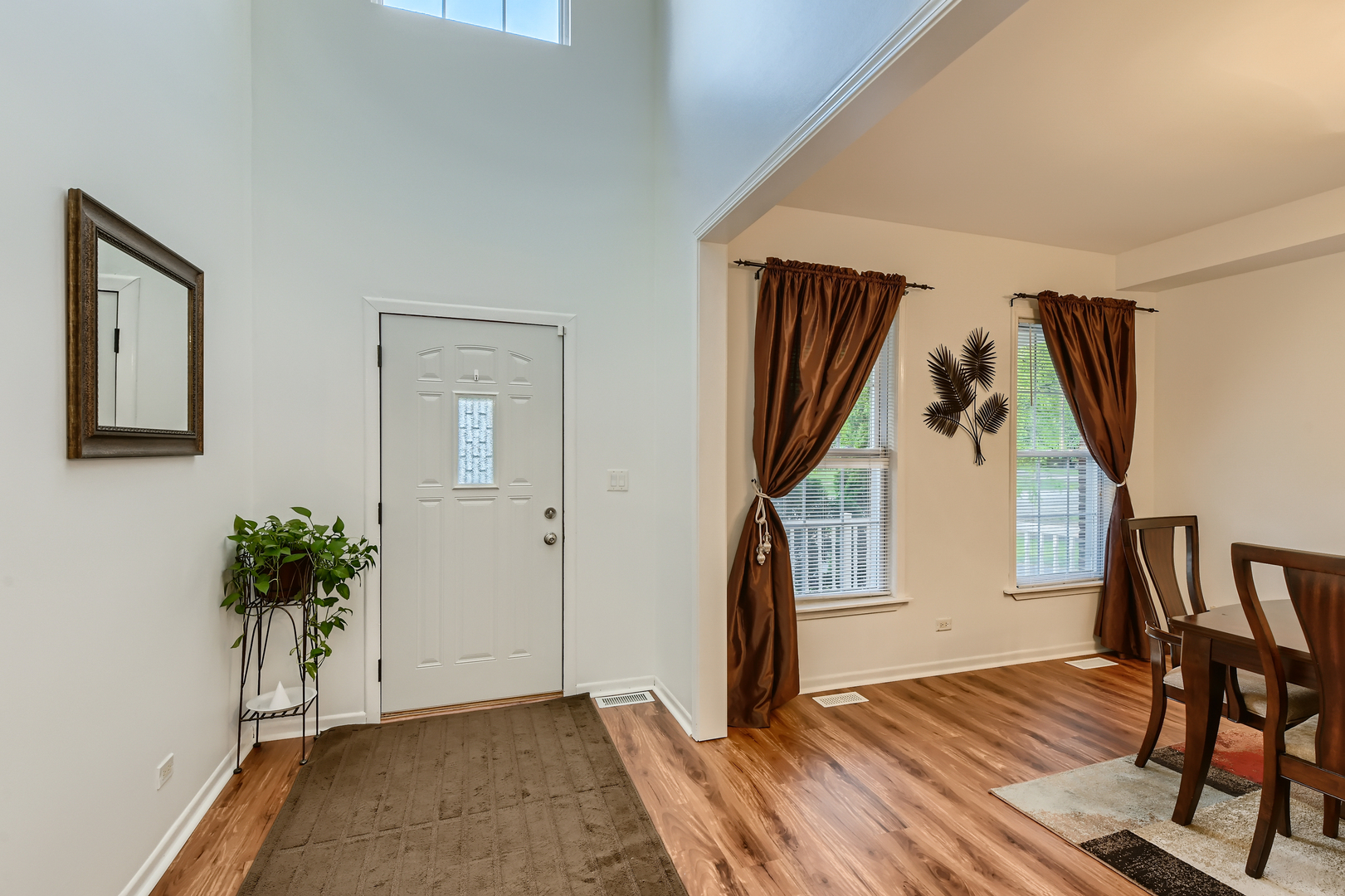 321 Rockhurst Road Bolingbrook, IL 60440 - Photo 3 of 21 a view of entryway with wooden floor and stairs
