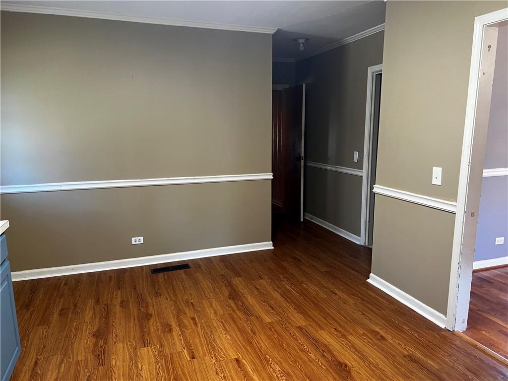 606 Pisgah Way Calhoun, GA 30701 - Photo 11 of 18 a view of an empty room with wooden floor