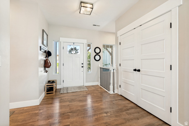 332 South 500 West Payson, UT 84651 - Photo 5 of 50 Spacious entryway featuring wood-finish style lvp flooring, entry door with sidelights, a contemporary ceiling light fixture, and white trim throughout