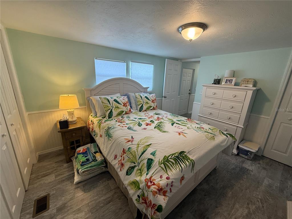 6190 Daffodil Road Venice, FL 34293 - Photo 11 of 22 a bedroom with a bed and a dresser