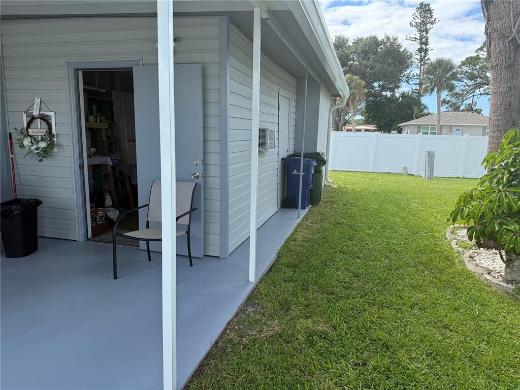 6190 Daffodil Road Venice, FL 34293 - Photo 13 of 22 a backyard of a house with table and chairs