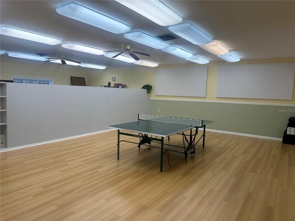6190 Daffodil Road Venice, FL 34293 - Photo 15 of 22 a view of a dining room with furniture and wooden floor